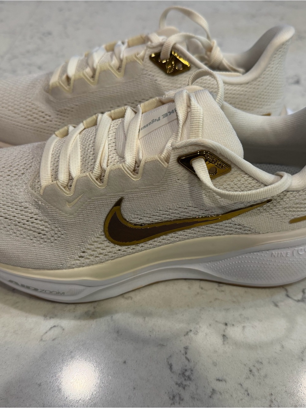 Nike Women’s Sneakers - Cream with Gold Swoosh